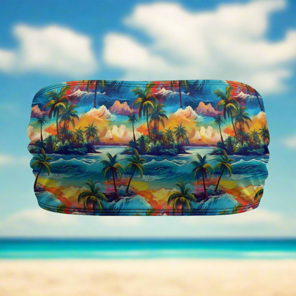 Colorful beach-themed bandeau top with palm trees and sunset design on a beachy background