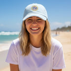 Girl wearing USA 250 Anniversary baseball hat on the beach