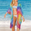 Swimwear model wearing a colorful tie-dye cover-up on Miami beach