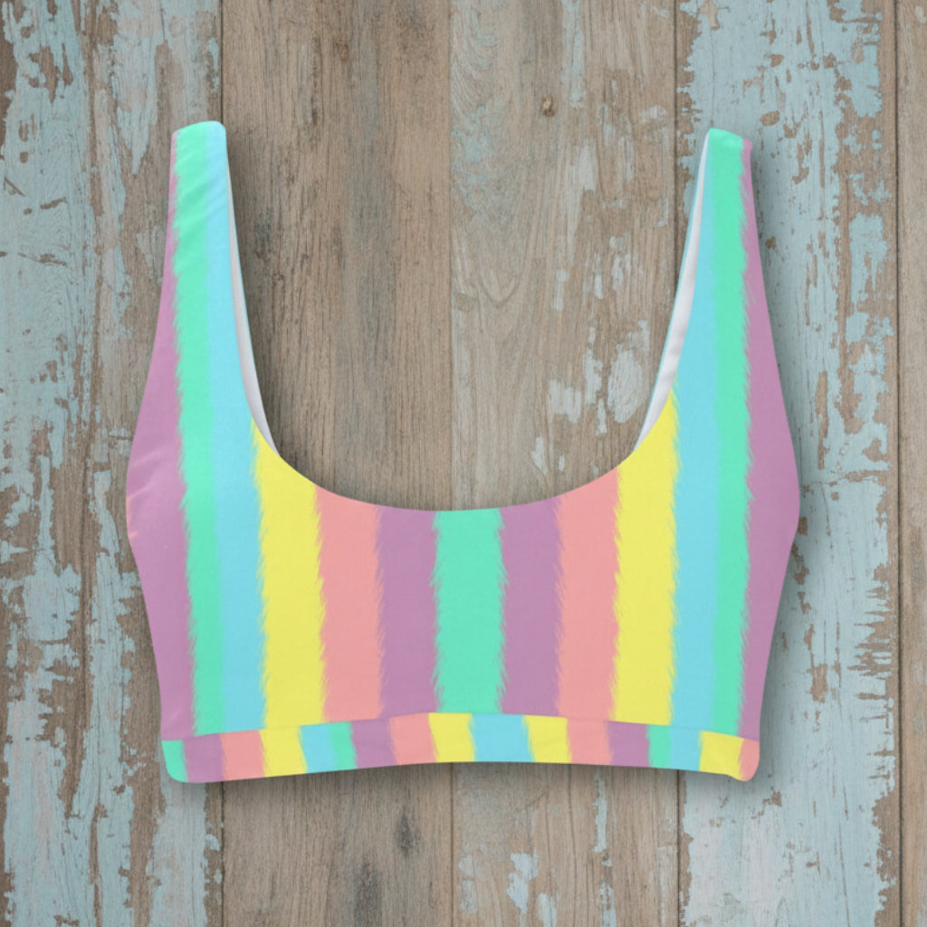 Colorful striped crop top on a rustic wood background