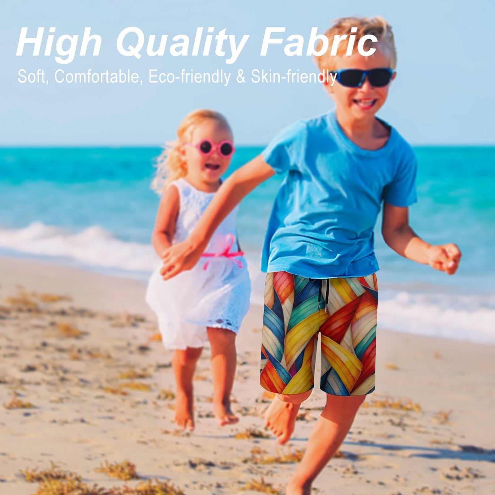 Two children running on a beach, the boy wearing board shorts by Bongo Beachwear featuring soft, high-quality, eco-friendly fabric and a nautical inspired pattern