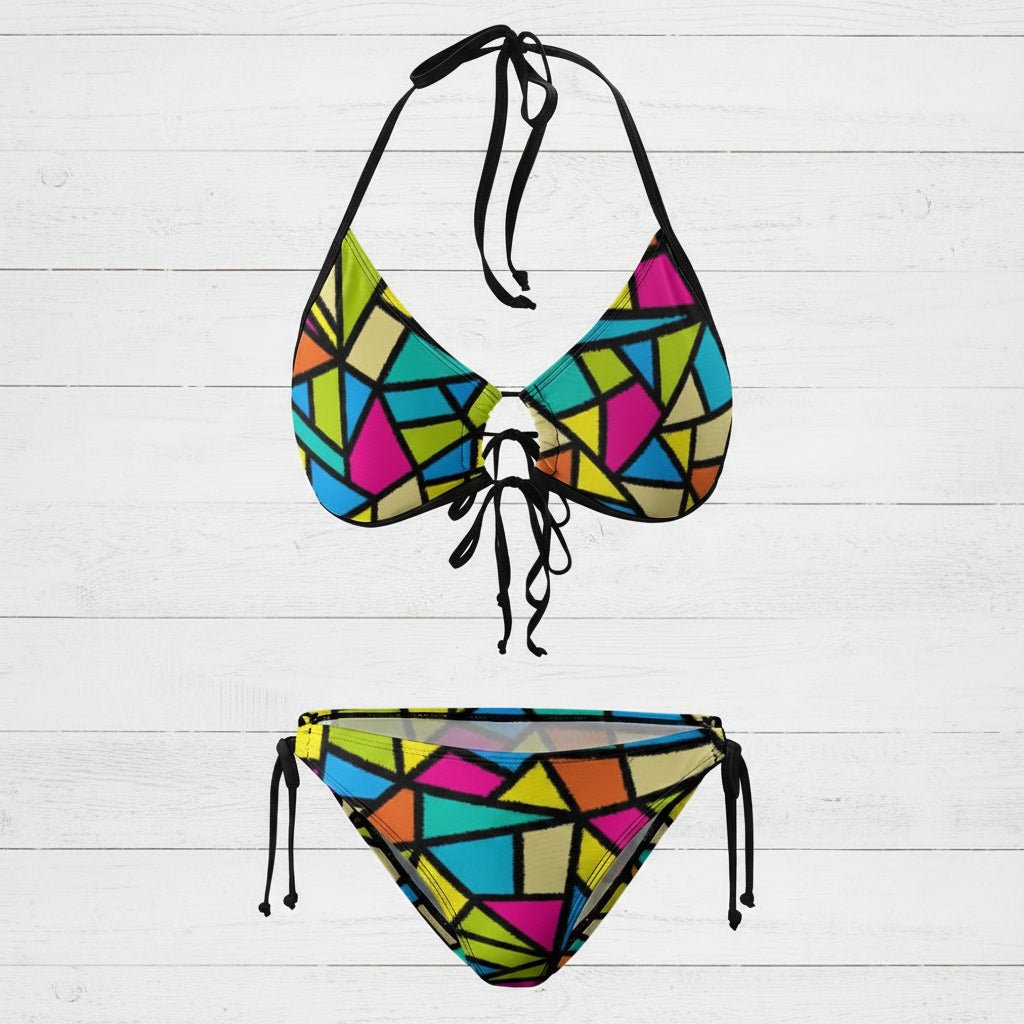 Colorful geometric-patterned bikini set on a white background