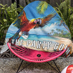 Jimmy Buffett Beach Towel draped over an acapulco chair next to a pool in Key West