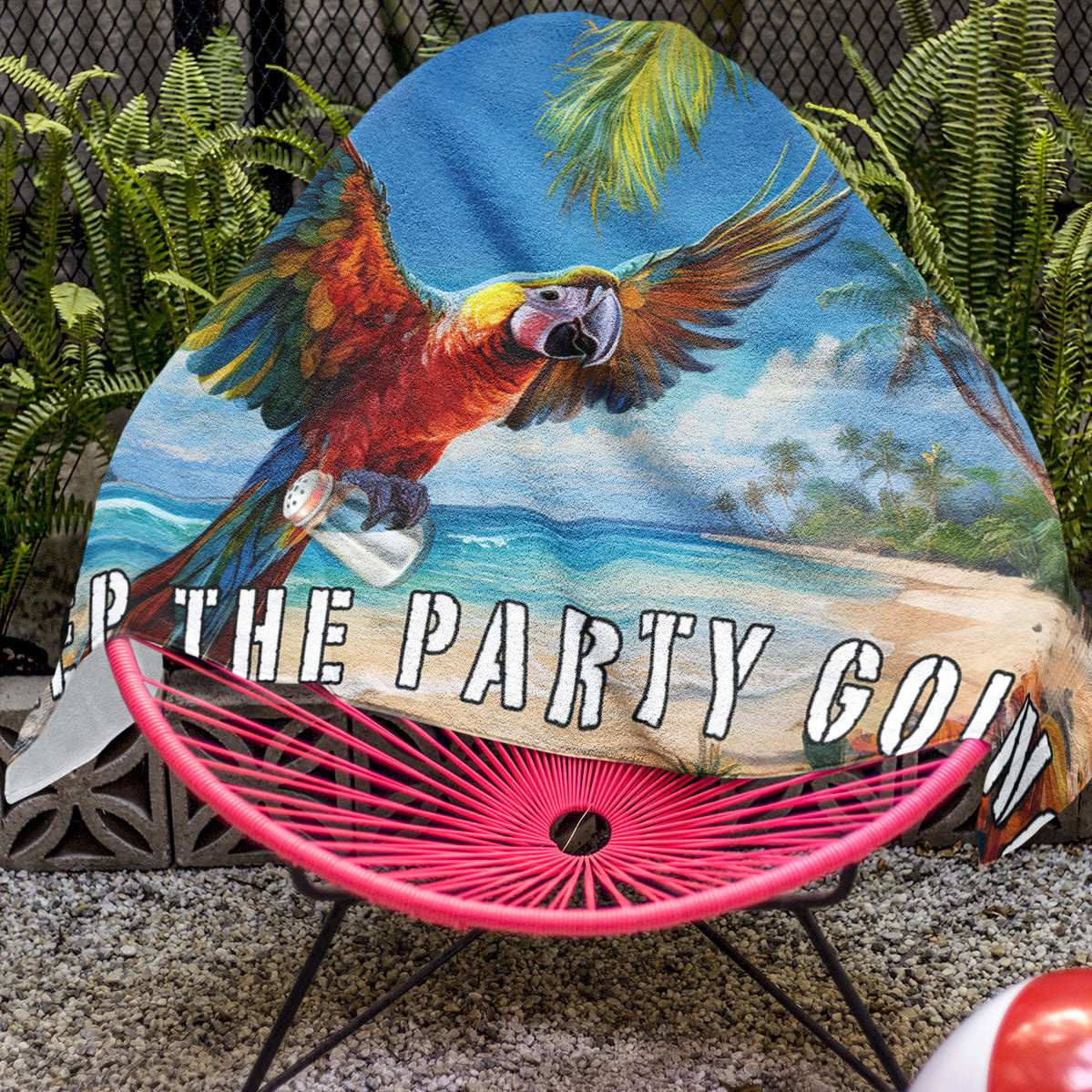 Jimmy Buffett Beach Towel draped over an acapulco chair next to a pool in Key West