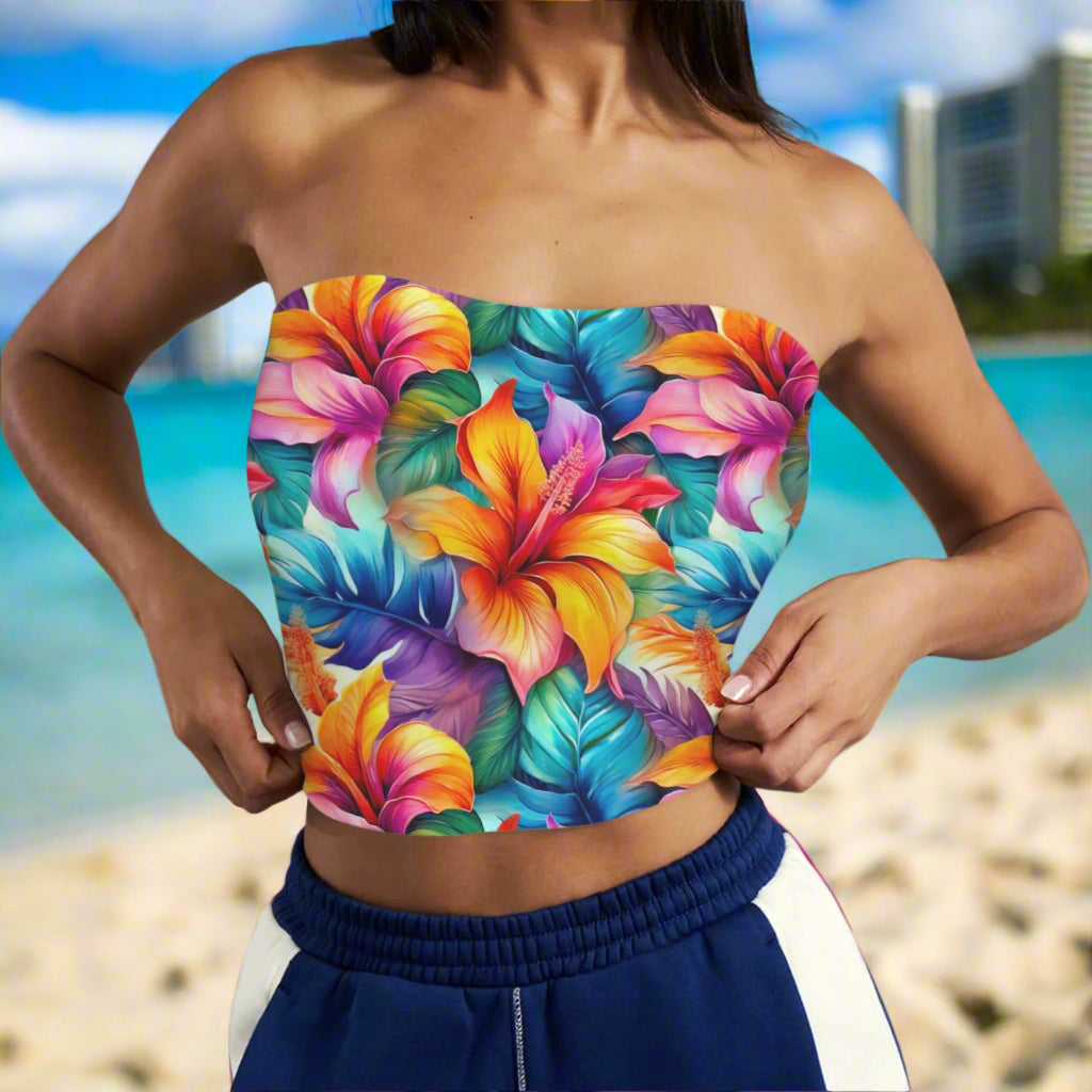 Colorful floral strapless top worn by a swimwear model standing on Waikiki Beach