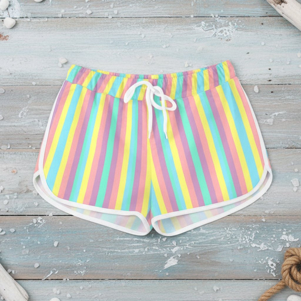 Pastel striped shorts worn by a person on a white background