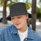 Woman wearing a black Bongo Beachwear Bucket Hat with a subtle shark pattern hanging out in Key West Florida