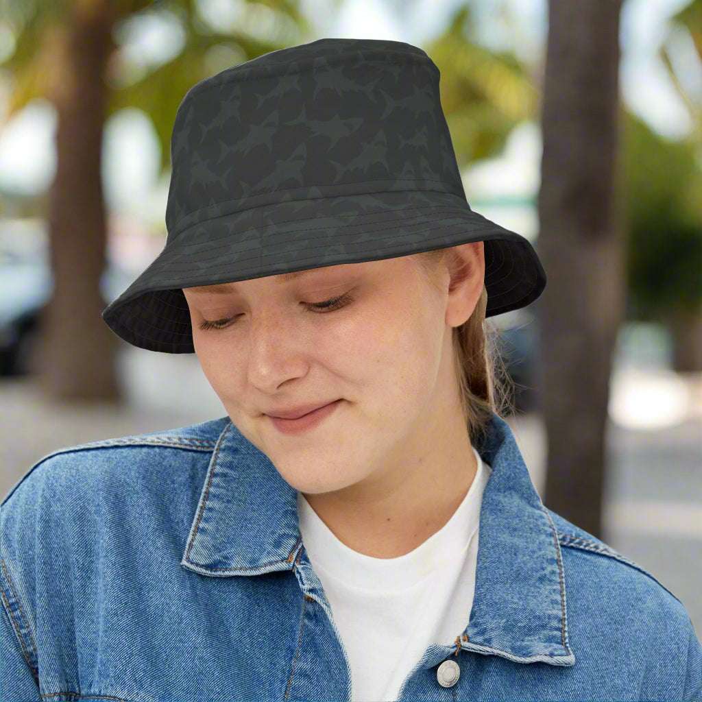 Woman wearing a black Bongo Beachwear Bucket Hat with a subtle shark pattern hanging out in Key West Florida
