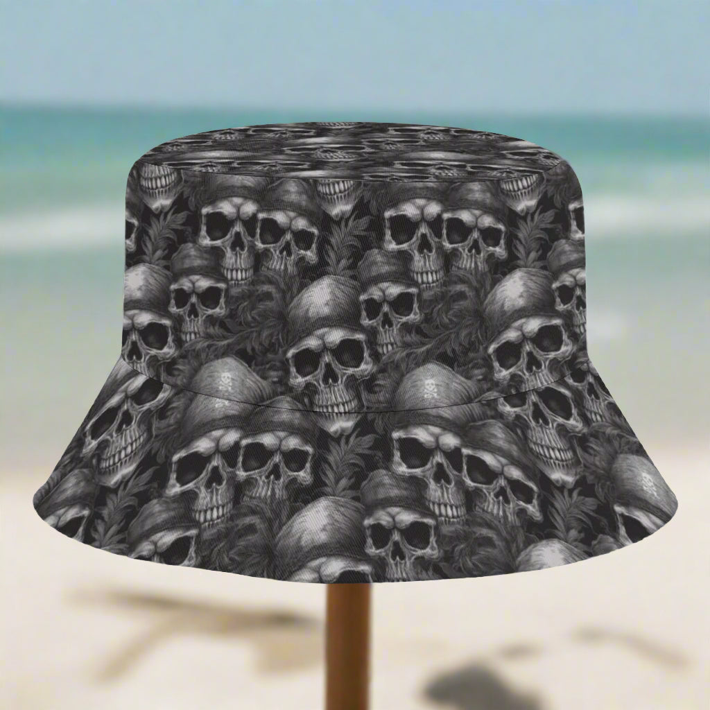 Bucket hat with black and white skull pattern on a beach in St. Somewhere