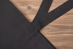 Black fabric with a subtle pattern on a white background