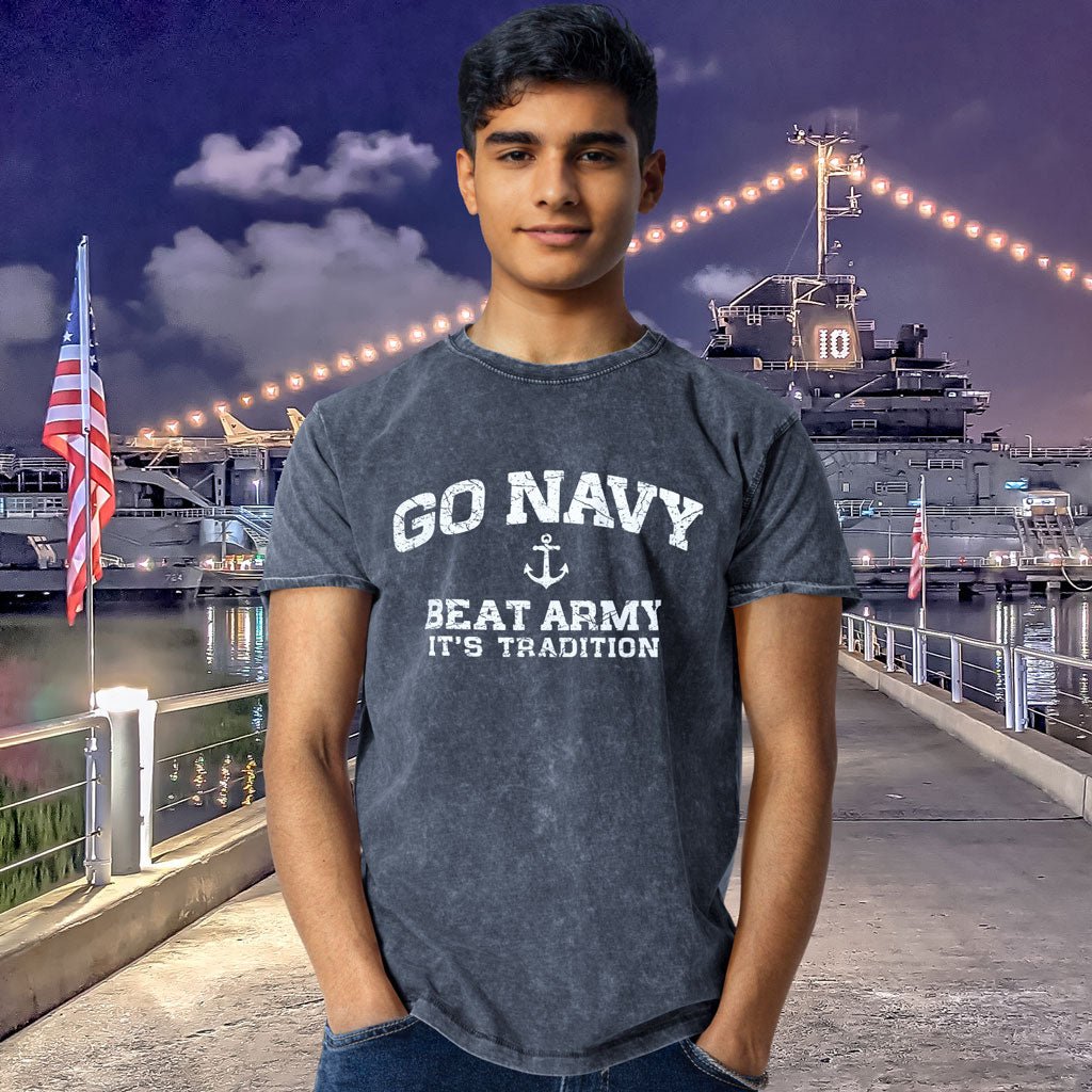 Person wearing a 'Go Navy Beat Army' t-shirt with a naval ship in the background.