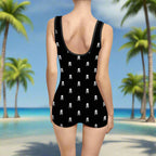 Vintage black bathing suit on a young swimwear model watching the waves