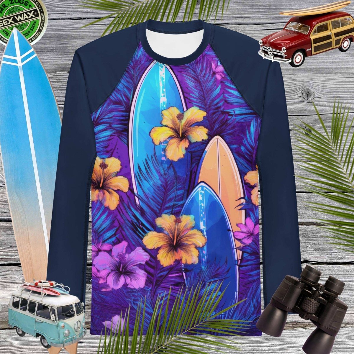 Long-sleeve sun rashie with surfboard and floral design on a wooden background