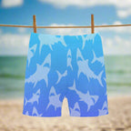 Blue shorts with shark pattern hanging on a clothesline at the beach in Key Largo