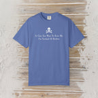 A blue short-sleeve crewneck t-shirt with a white skull and crossbones graphic and the text 'In Case You Want To Scare Me I'm Terrified Of Boobies' printed on the chest, displayed flat on a rustic wooden plank background.