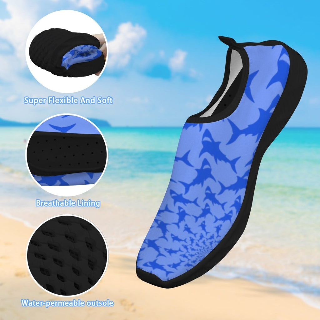 Blue and black shark-patterned water shoes shown on a beach background with three circular detail callouts highlighting flexibility, breathable lining, and water-permeable outsole.