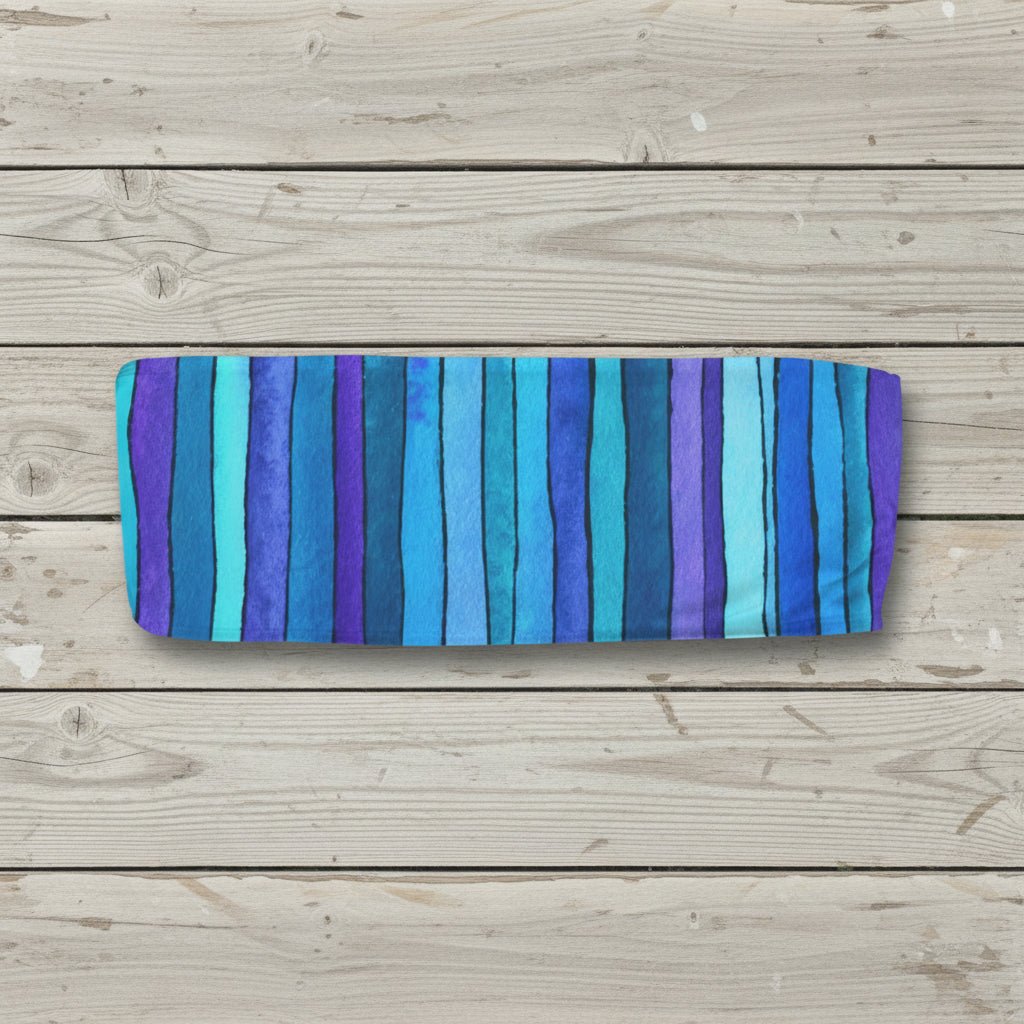 Striped tube top with blue and purple horizontal stripes on a white background