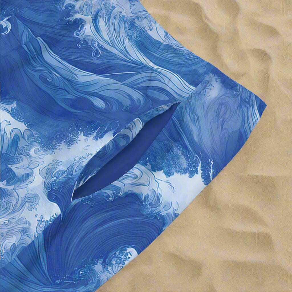 close up of ocean wave pattern board shorts pocket lining. lying in the sand