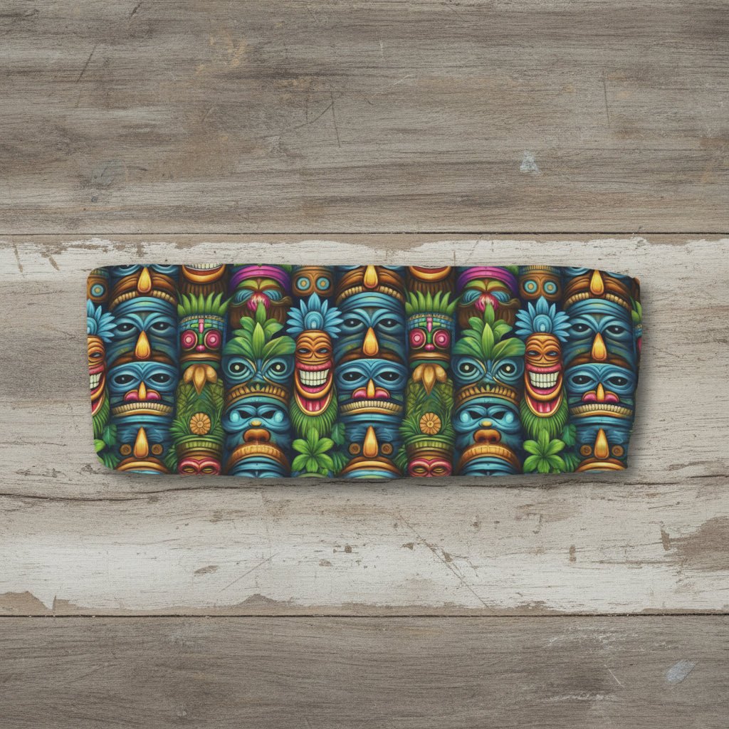 Colorful tiki mask pattern on a rustic wood background