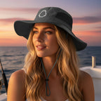 Model wearing a Gray sun hat with a chin strap and a shark jaw embroidery 