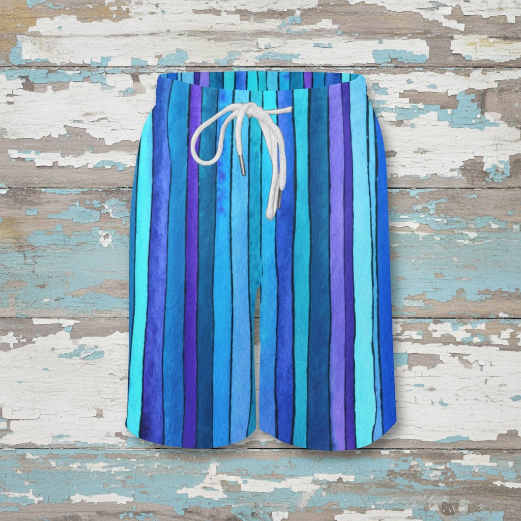 Blue and purple striped shorts with a white drawstring on a nautical wood background