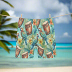 Shorts with a tropical pattern featuring parrots, drums, and flowers hanging on a clothesline in an island beach paradise