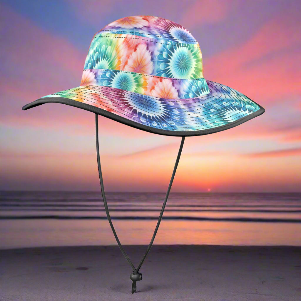Colorful tie-dye bucket hat on a beachy background