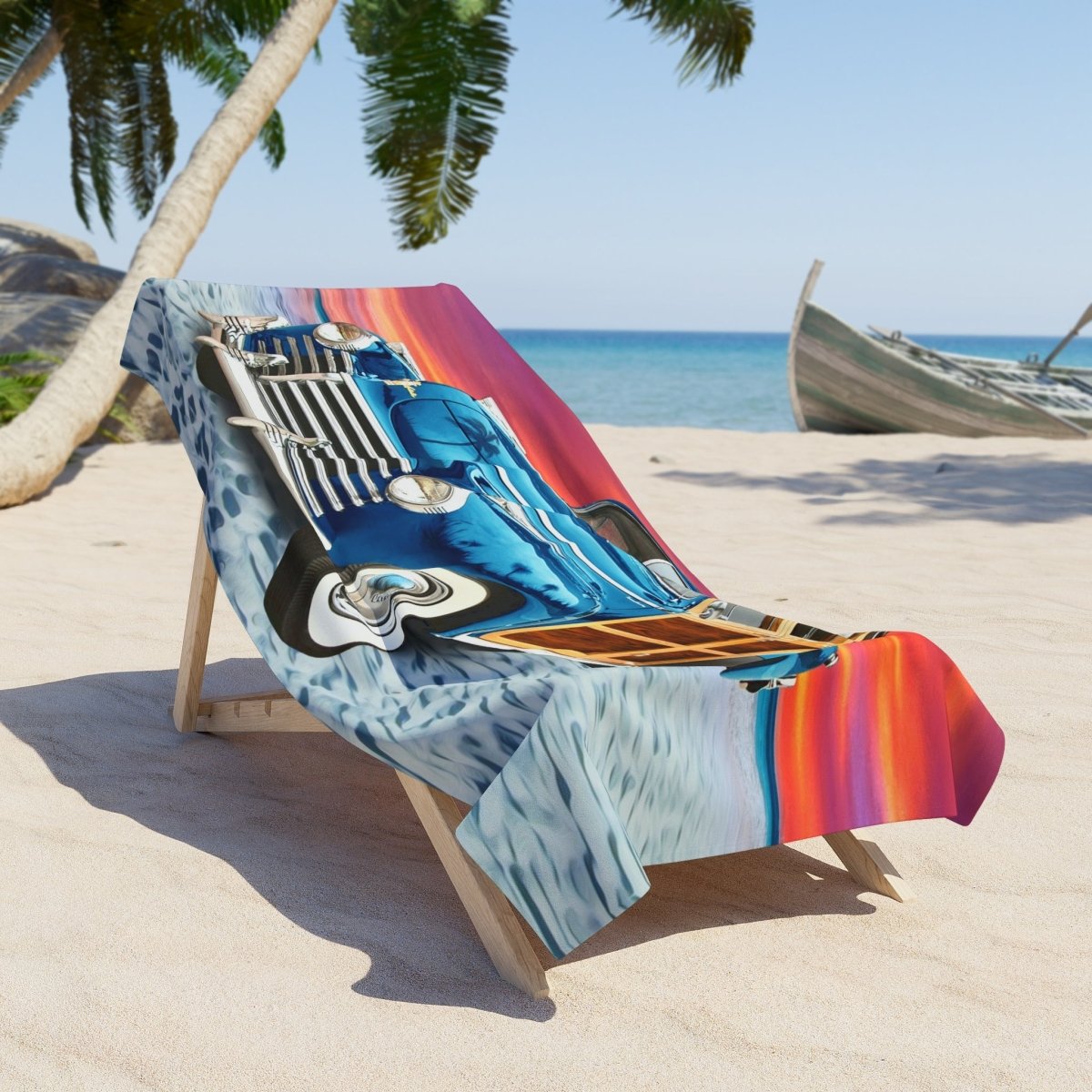 A colorful beach towel draped over a wooden lounge chair on a sandy beach, featuring a vintage blue car illustration and vibrant pink, orange, and yellow stripes.