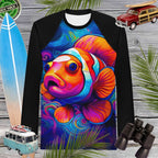 Long-sleeve rash guard with a colorful clown fish design on a wooden background with surfboard, car, and binoculars.