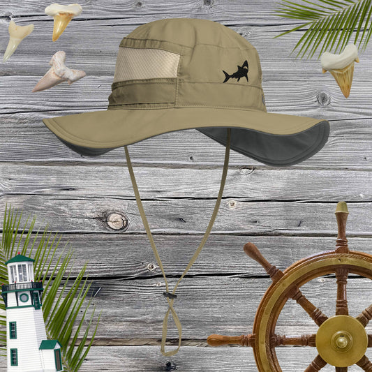 Sage Booney Hat by Columbia with a Rad Shark Embroidery  on front against a rustic wood background with shark teeth and nautical icons