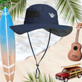 Navy blue sun hat with shaka sign embroidery surrounded by a surfboard, ukulele, and vintage car on a beach background