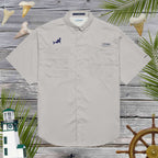 Light gray short-sleeve shirt with embroidered shark design on a wooden background with decorative elements.