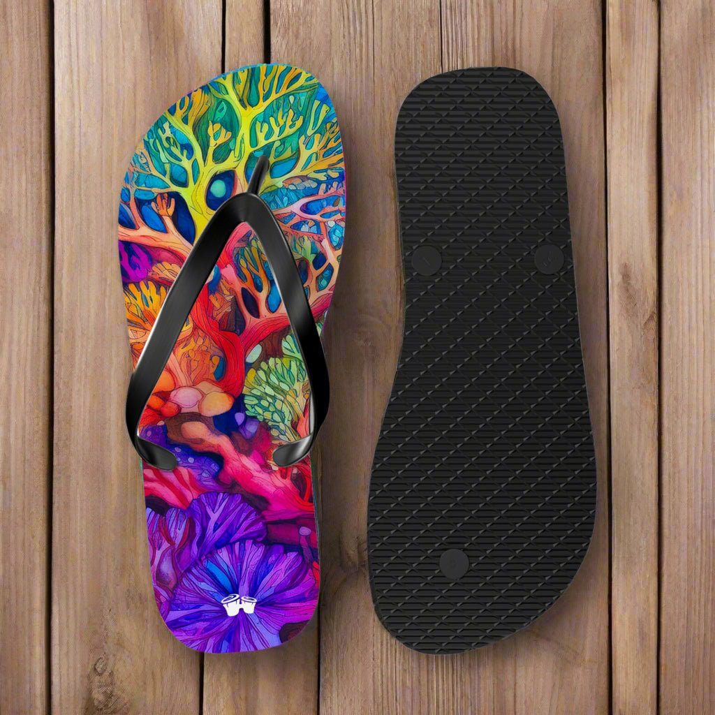 Colorful flip-flop sandal with a black insole on a rustic nautical wood background