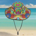 Colorful crochet print pattern on a wide brim bucket hat on a beachy background