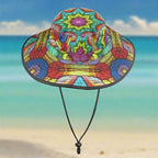 Colorful crochet print pattern on a wide brim bucket hat on a beachy background