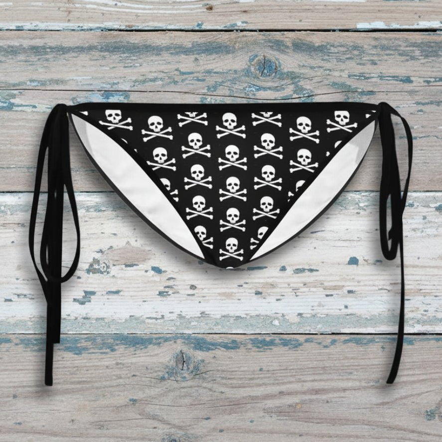 Black and white paisley patterned bikini bottom with straps on a white background