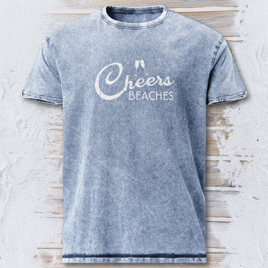 Gray t-shirt with 'Cheers Beaches' text on a textured surface