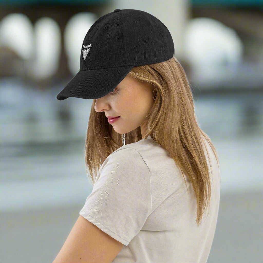 Girl in Denim Hat With Embroidered Shark Tooth hanging out in Daytona Beach