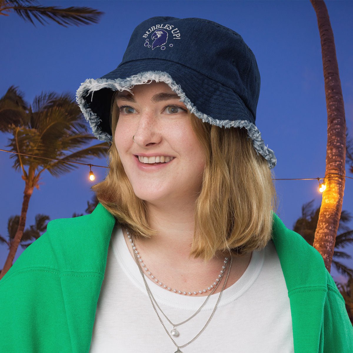 Person wearing a blue cap with palm trees in the background