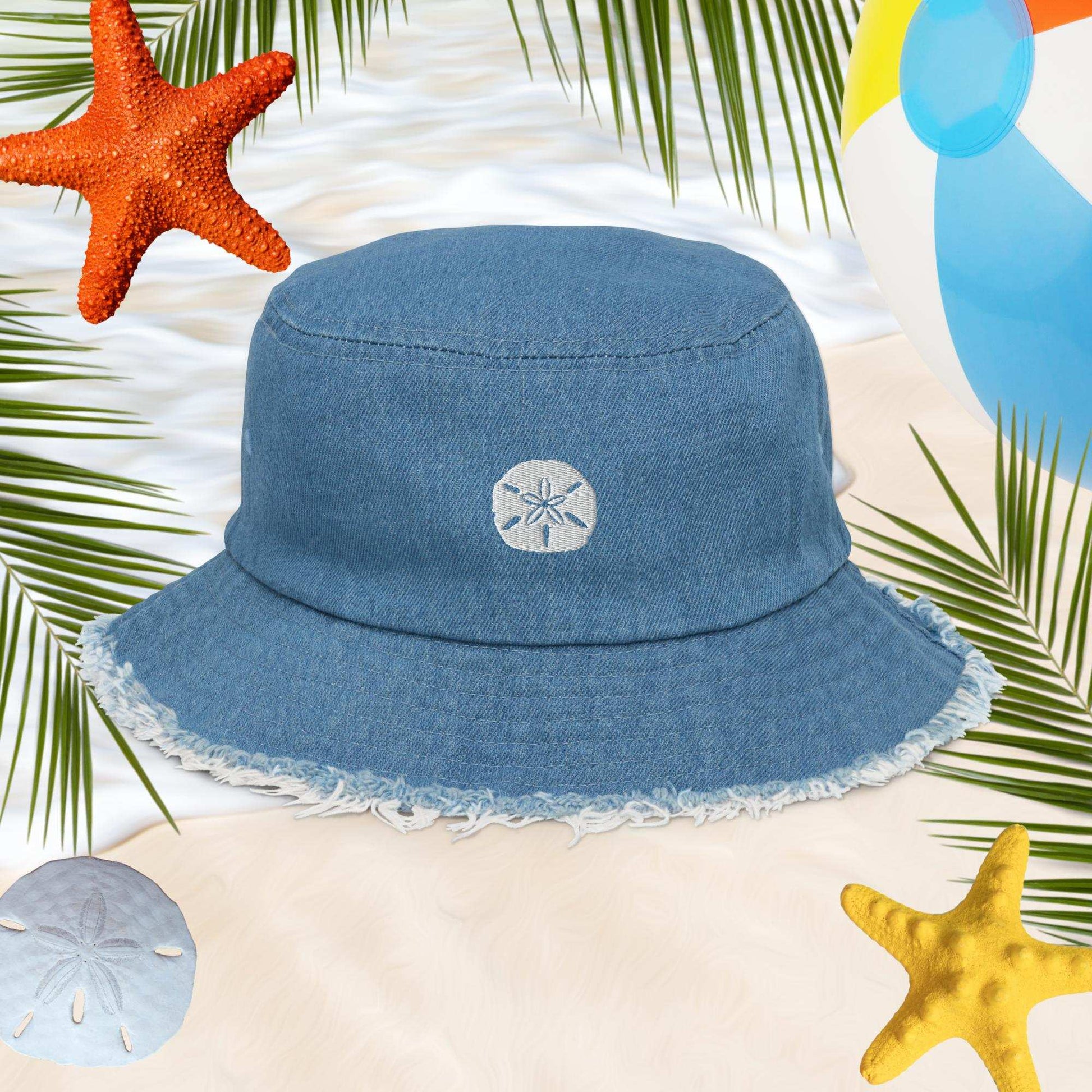 Sand Dollar Embroidered on Blue Denim Bucket Hat with frayed edges around the brim.