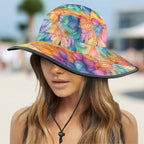 Colorful floral bucket hat worn by a model on a beach background