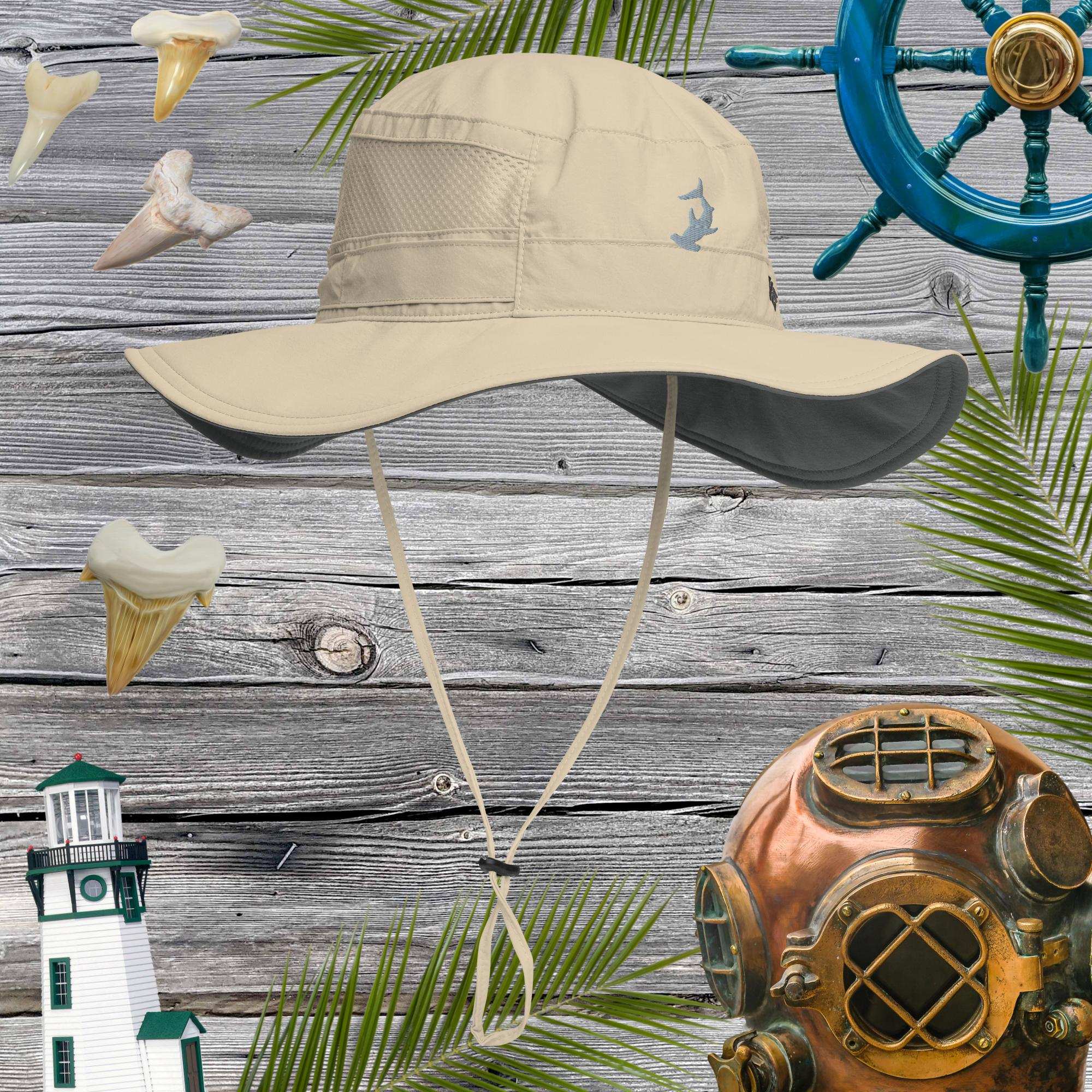 Beige booney hat on a wooden background with nautical decorations.