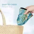 Hand holding a floral-patterned mask with text 'Easy to carry' and 'Folding for storage' on a light blue background.