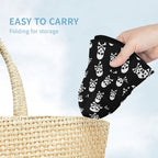 Hand holding a black bucket hat with white skull patterns above a woven basket, with text 'Easy to carry' and 'Folding for storage