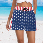 woman wearing blue shorts with white star pattern on an American beach