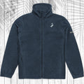 A black fleece zip-up jacket with a stand-up collar, laid flat against a white wood plank background with a faint palm leaf pattern.