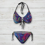 Colorful bikini set with paisley pattern on a white background