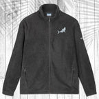 A dark gray fleece zip-up jacket with a stand collar, shown flat against a white wood plank background with a palm leaf pattern overlay. The jacket features a small white circular logo on the left chest and a small white logo on the right sleeve.