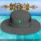 Gray wide-brimmed hat with a logo on a turquoise wooden surface with a scenic background.