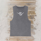 A dark gray sleeveless tank top with a white skeleton hand graphic on the chest, laid flat on a rustic wooden plank background.